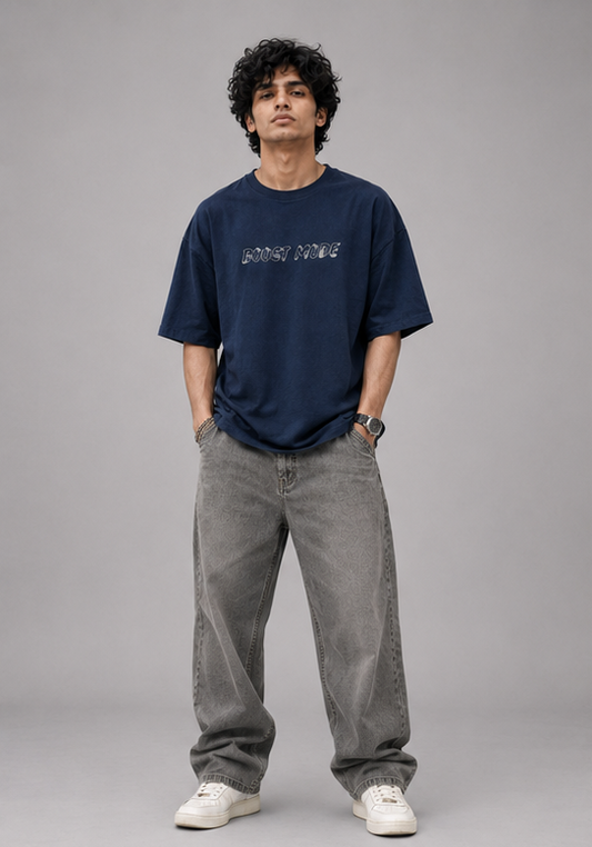 Male model wearing Oversoul Boost Mode oversized t-shirt in deep navy blue full body front view