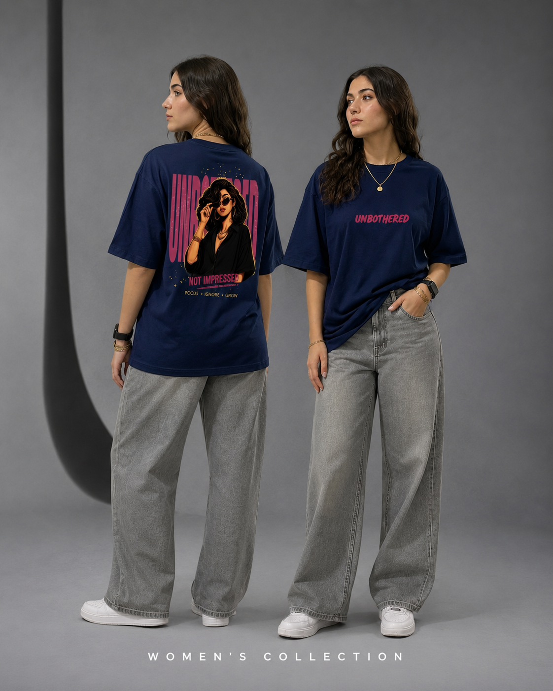 Women’s collection fashion mockup featuring a young woman wearing an oversized navy blue graphic t-shirt with “UNBOTHERED” text on the front and a bold illustrated back print, styled with loose gray jeans and white sneakers in a modern studio setting.