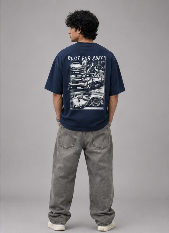 Male model showing back graphic print of Oversoul Boost Mode oversized t-shirt in deep navy blue