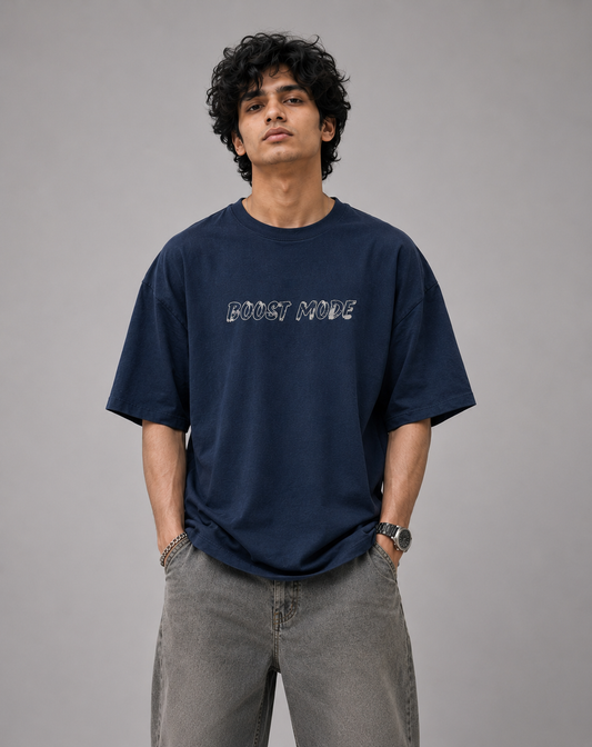 Male model wearing Oversoul Boost Mode Graphic Unisex Oversized T-Shirt in deep navy blue front view