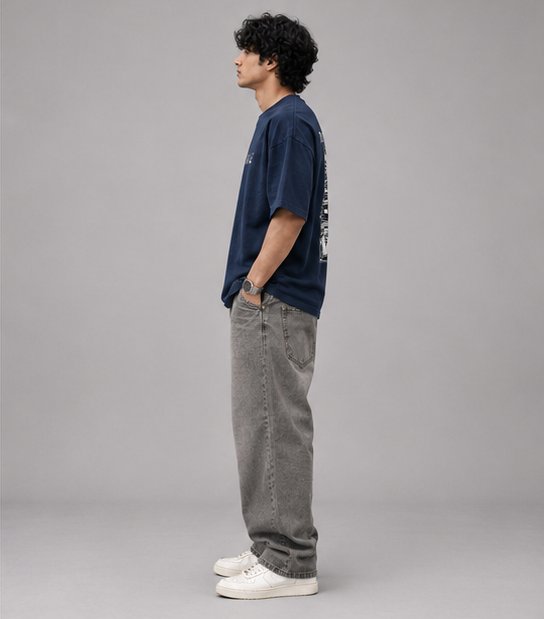 Male model wearing Oversoul Boost Mode Graphic Unisex Oversized T-Shirt side profile view in deep navy blue