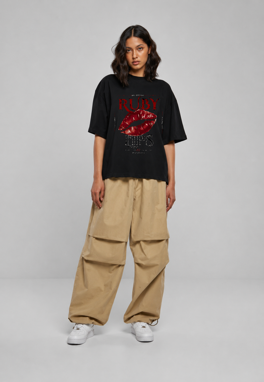Female model wearing Oversoul Ruby Lips oversized t-shirt in black full body front view